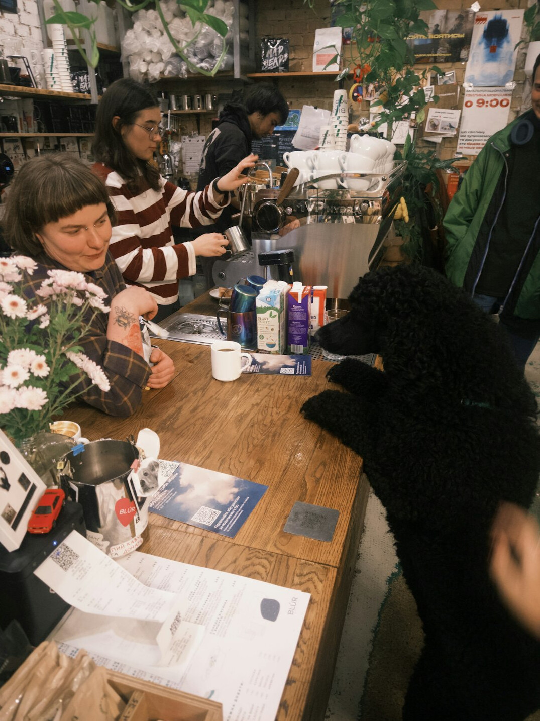Instructor leading a small group workshop around a table