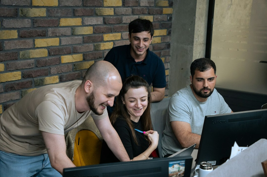 team reviewing course analytics